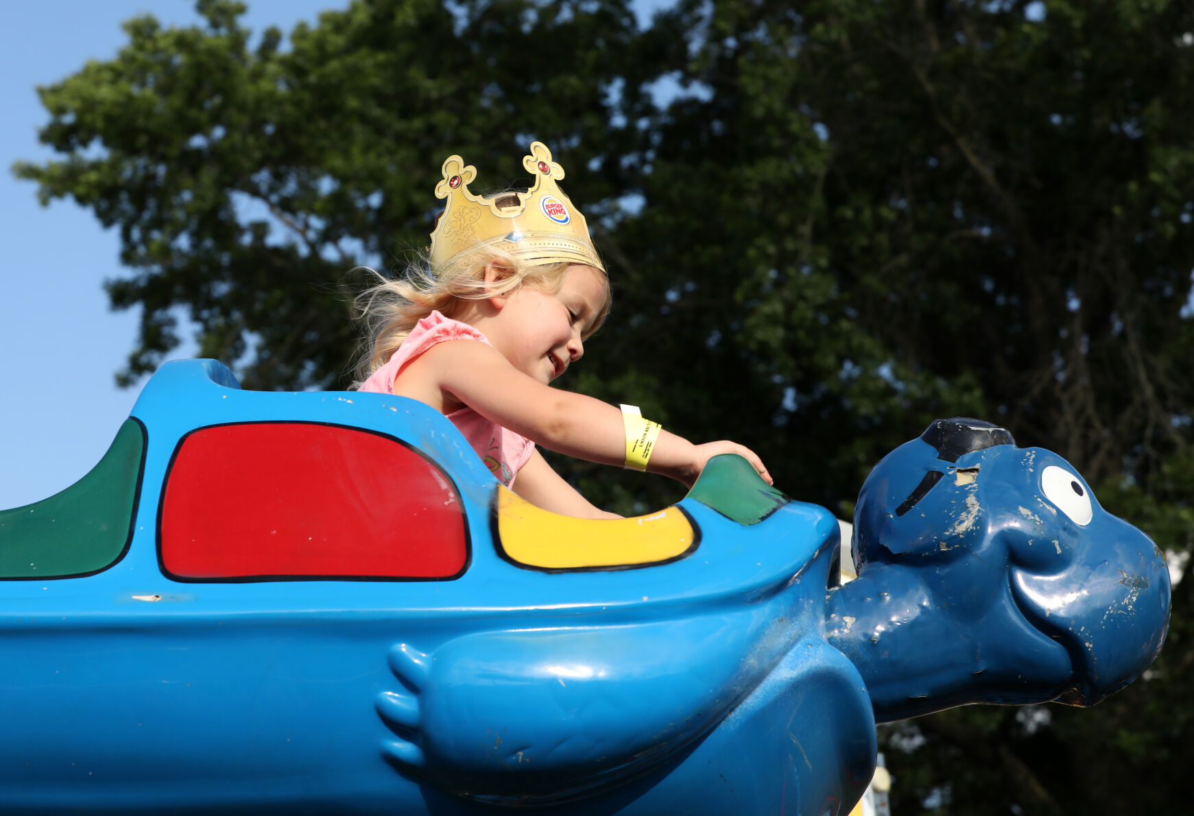 Mia Booher rides a carnival ride